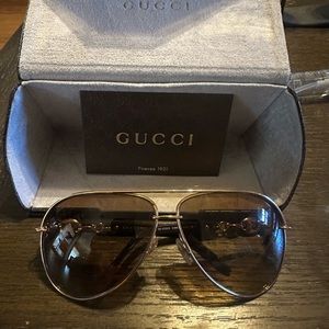 Women’s Gucci Sunglasses.